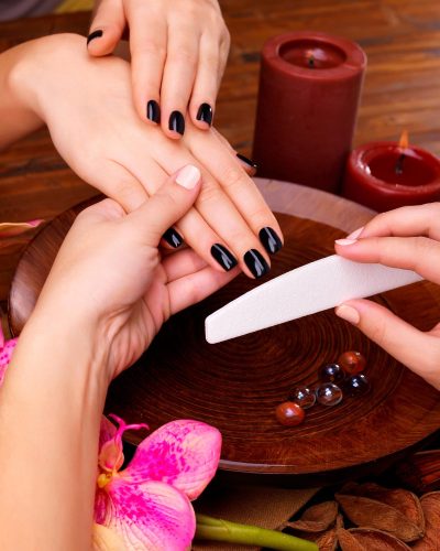 manicurist-master-makes-manicure-woman-s-hands-spa-treatment-concept