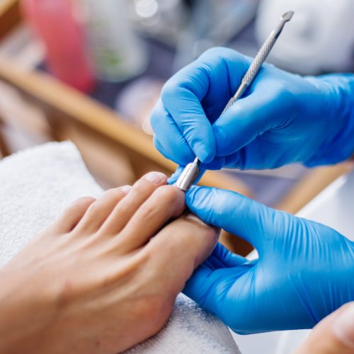 pedicure-process-home-salon-pedicure-foot-care-treatment-nail-process-professional-pedicures-master-blue-gloves-make-pedicure