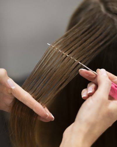 woman-getting-her-hair-cut-beauty-salon