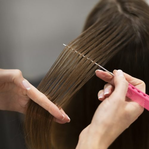 woman-getting-her-hair-cut-beauty-salon